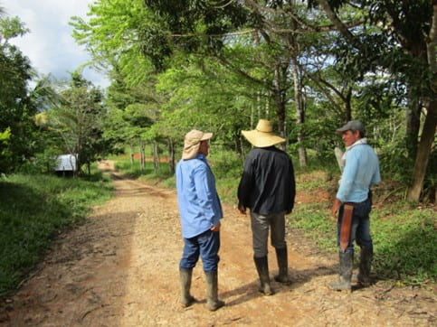 Hector with two other local farmers, on their way to show us the local lagoon. 